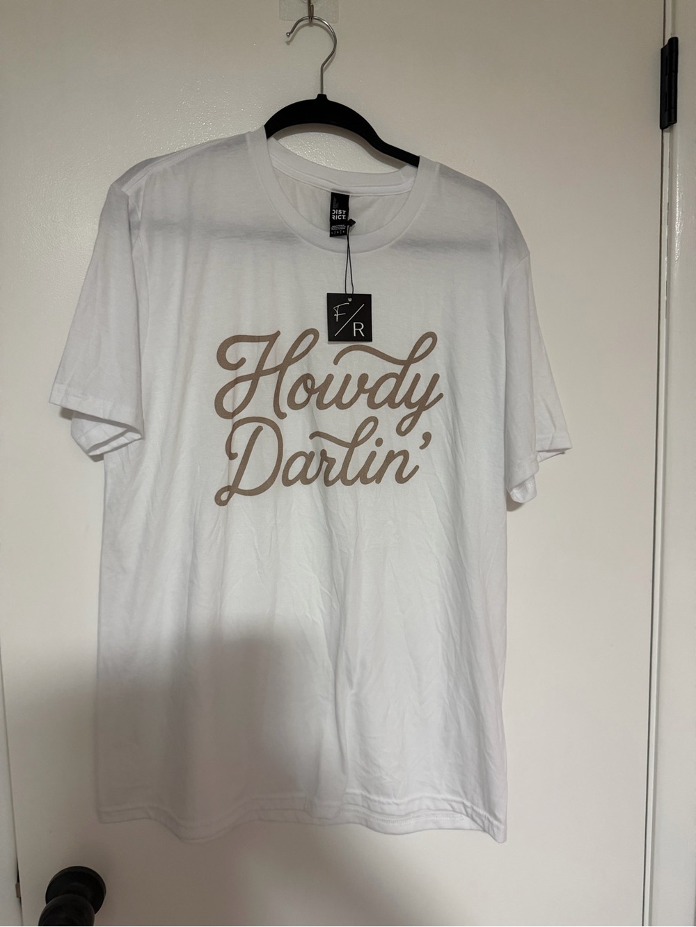 District White Tee with Tan "Howdy Darlin'" Script